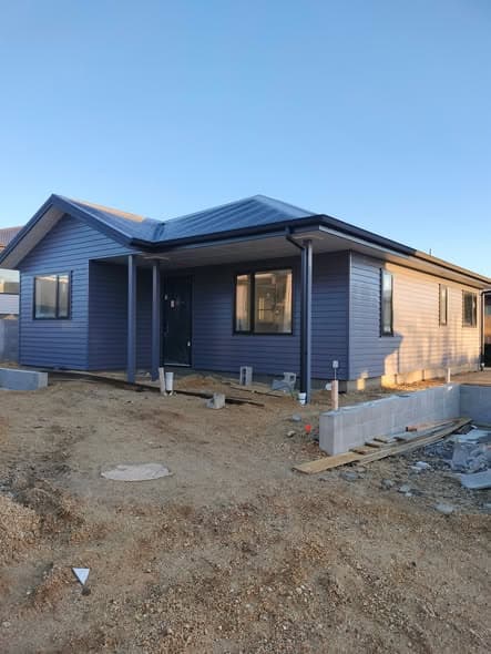 Full exterior repaint with charcoal cladding